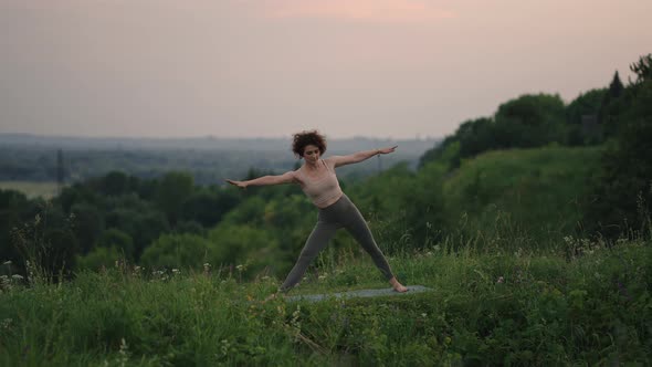 Woman Doing Yoga In Hawaii Mountains Meditating