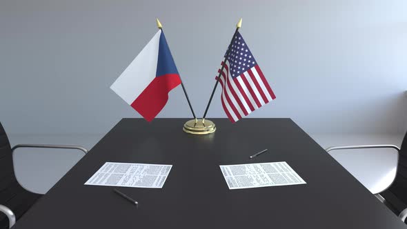 Flags of the Czech Republic and the United States on the Table