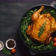Roasted Whole Chicken or Turkey Served in Iron Pan Placed on Black Background Top View - VideoHive Item for Sale