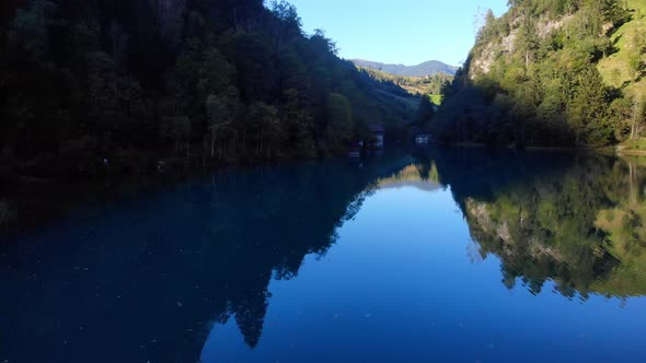 Klammsee Lake By Kaprun City In Austria With Beautiful Mountains And Lush Vegetation - drone shot