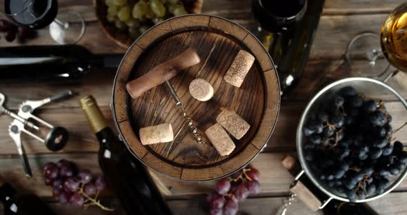 Cork and Corkscrew on a Keg with Wine on the Table. On a Wooden Background.