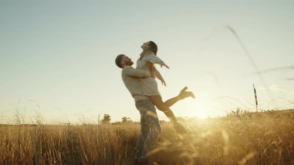 Boy does dance with girl at sunset