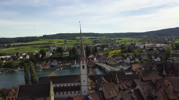 Aerial orbit of Sr. George Monastery and tower in picturesque Stein am Rhein village next to Rhine r