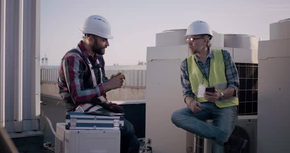 Engineers Having a Break on a Cell Tower