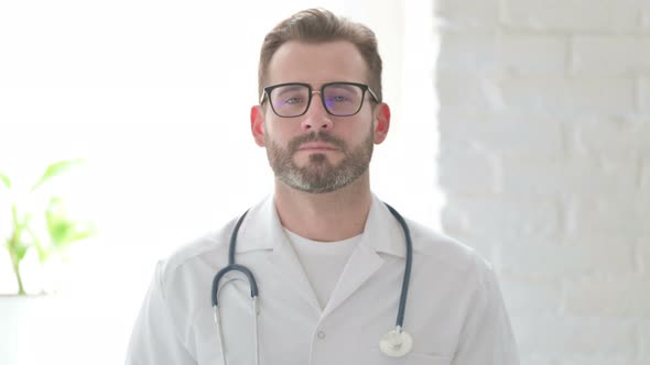 Portrait of Doctor Shaking Head As Yes Sign Approval