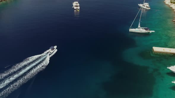 Aerial view of boat driving between islands, Ithaki, Greece.