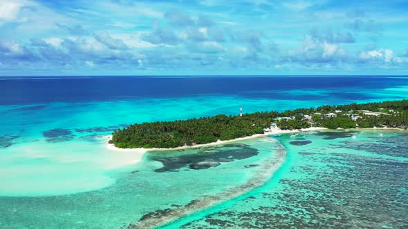 Aerial top down scenery of tranquil tourist beach voyage by turquoise ocean with clean sandy backgro