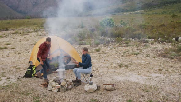 Caucasian couple camping in nature