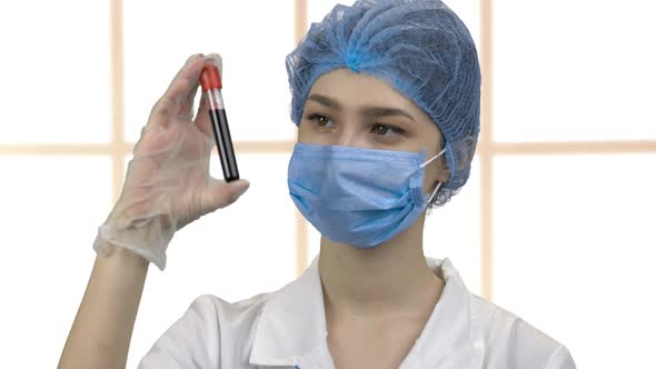 Doctor Nurse Holding Blood Test Tube Capsule