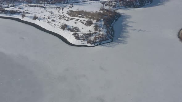 Winter scenery on frozen lake 4K aerial video