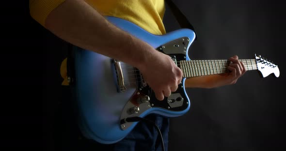 Male Guitarist Plug in Electric Guitar