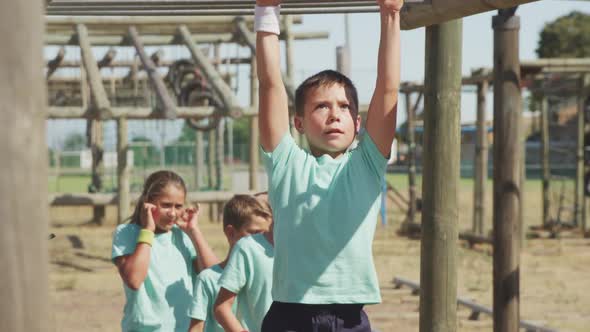 Caucasian boy training at boot camp