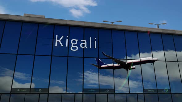 Airplane landing at Kigali Rwanda airport mirrored in terminal