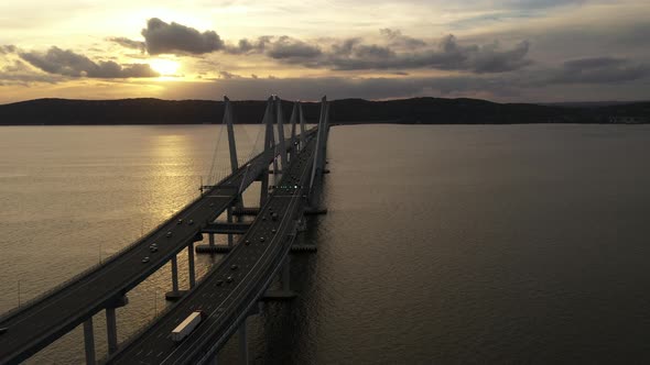 An aerial shot over the Mario M. Cuomo Bridge from the north side. The camera dolly in over the brid