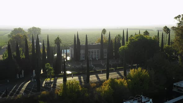 Low orbit aerial of Grand Island Mansion wedding venue near Sacramento