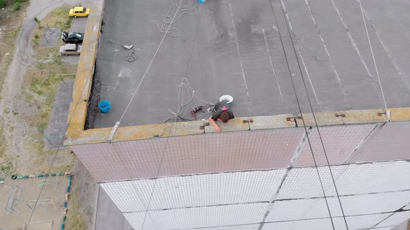 Industrial Alpinism, Aerial View, Work on Outer Insulate Building with Styrofoam