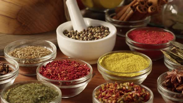 Various Spices in Glass Bowls Closeup