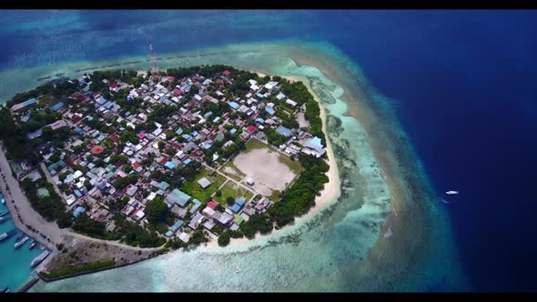 Aerial flying over tourism of exotic coastline beach holiday by shallow lagoon with bright sandy bac
