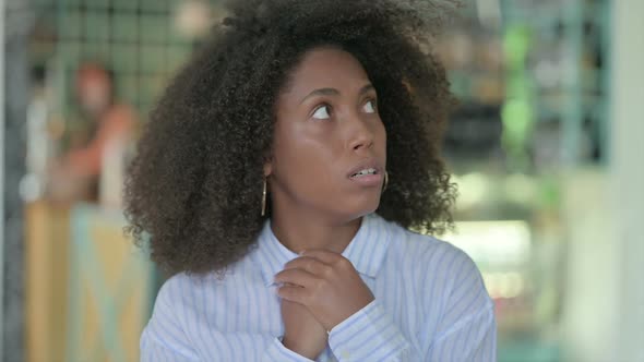 Portrait of Worried African Businesswoman Feeing Scared