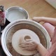 Female Potter Sitting and Makes a Cup on the Pottery Wheel. Woman Making Ceramic Item. Pottery - VideoHive Item for Sale
