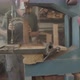 Carpenter cutting a wooden block with a saw machine - VideoHive Item for Sale