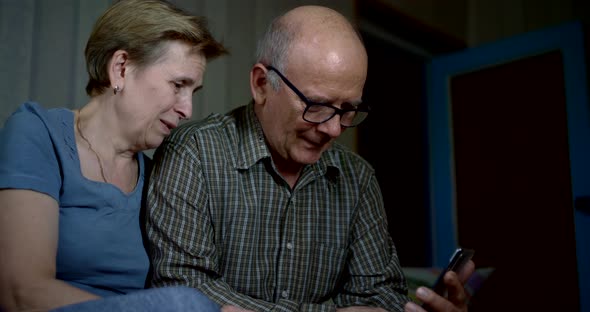 Communication By Internet Using Smartphone, Seniors Are Calling By Video, Sitting at Home