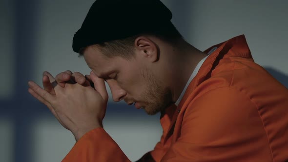 Nervous Caucasian Prisoner Sitting Alone