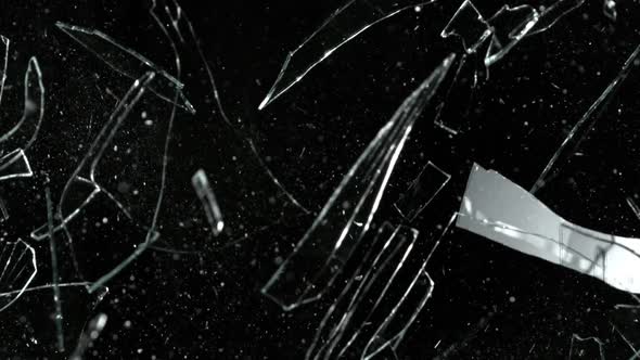 Super Slow Motion Shot of Real Glass Break at 1000 Fps Isolated on Black Background.