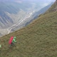 Aerial Shot of a Group of Tourists with Backpacks Climb the Mountain - VideoHive Item for Sale