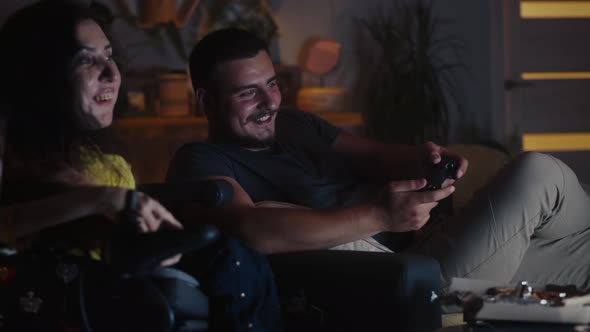 Man Playing Video Game Near Woman in Wheelchair