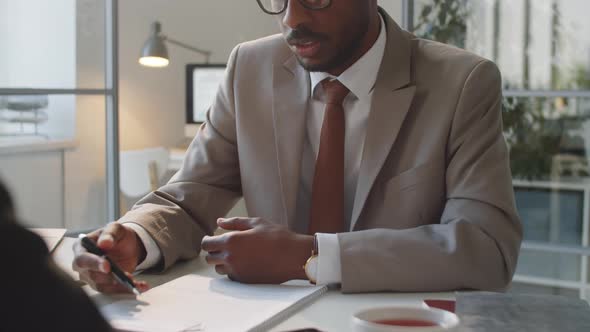 Black Businessman Discussing Contract with Partner