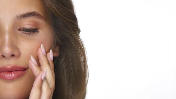 Half of Woman Face Applying Cream on Face