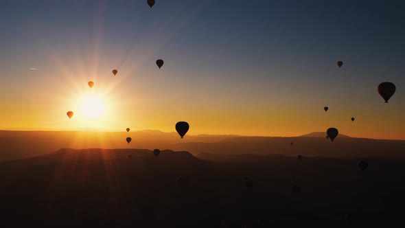 Balloons in the Sky at Sunrise