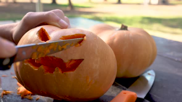 Organizing the last details for the Halloween holiday with the evil pumpkins