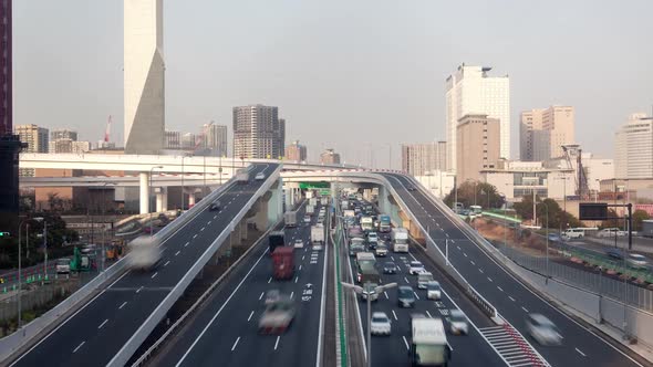 Timelapse Cars Drive Along Tokyo Road with Heavy Traffic