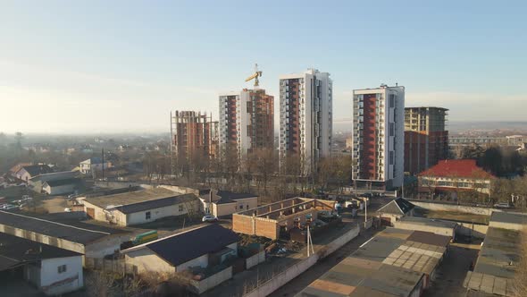 Aerial View of High Tower Crane and Residential Apartment Buildings Under Construction