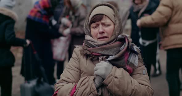 Scared And Anxious Female Refugee During War Crisis