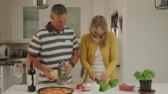 Couple preparing food in their kitchen