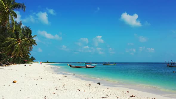 Aerial flying over sky of paradise sea view beach time by aqua blue lagoon with white sandy backgrou