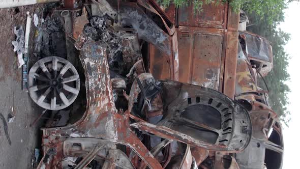 Vertical Video Irpin Bucha District  Destroyed Cars During the War in Ukraine