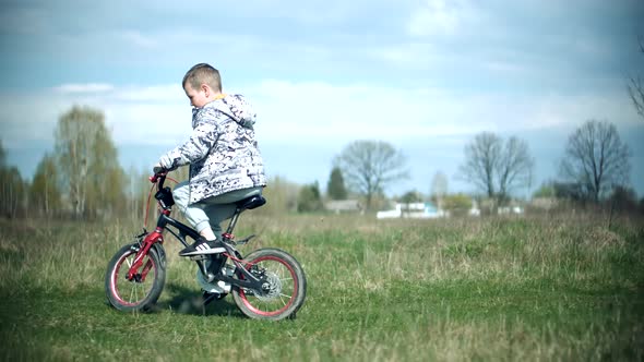 Active Child Riding Bike. Little Boy Cycling On Bicycle. Leisure Lifestyle Biking Recreation Ride.