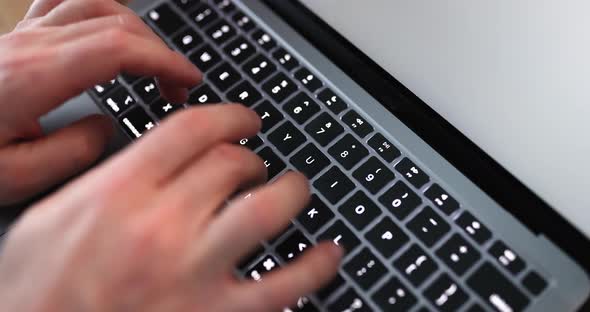 Male Hands Typing on Laptop Keyboard  Movie Slow Motion