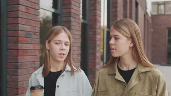 Twins Chatting and Walking Outside