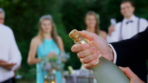 champagne toasting ceremony in background guests applauding