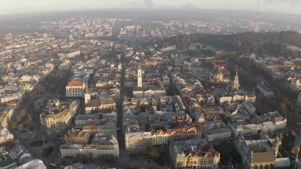 Flight Above the Roofs on Sunrise. Old European City. Ukraine Lviv City