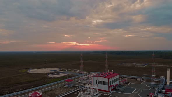 The Drone Takes Off Over an Oil and Gas Field in Northern Canada and Russia in the Rays of the