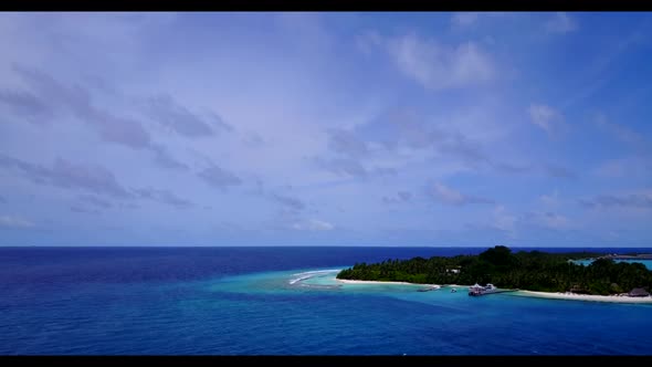 Aerial top view abstract of tranquil lagoon beach holiday by shallow ocean with bright sand backgrou