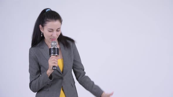 Young Businesswoman As Newscaster Singing and Looking Guilty