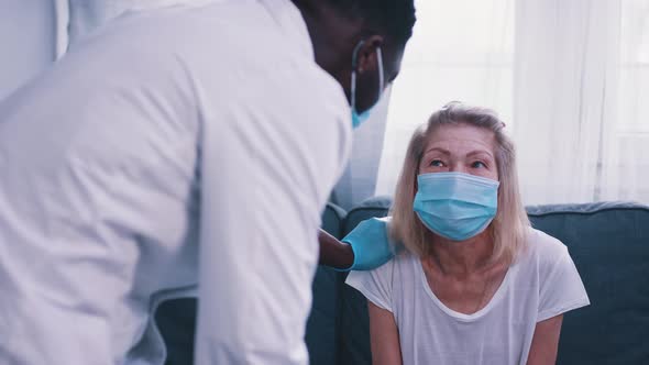 Elderly Woman Having Medical Check Up During Coronavirus Outbreak