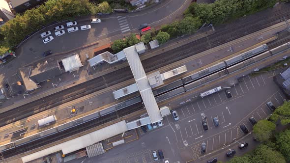 Trains Stopping at a Station in the UK Aerial View